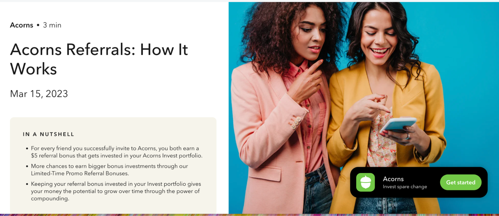 Acorns referral program webpage titled 'Acorns Referrals: How It Works' with date March 15, 2023. A box summarizes the offer: both the inviter and invited friend earn a $5 referral bonus invested in their Acorns portfolio, with opportunities for bigger limited-time referral bonuses and growth potential through compounding. On the right, two women in bright blazers smile while looking at a smartphone together against a teal background.