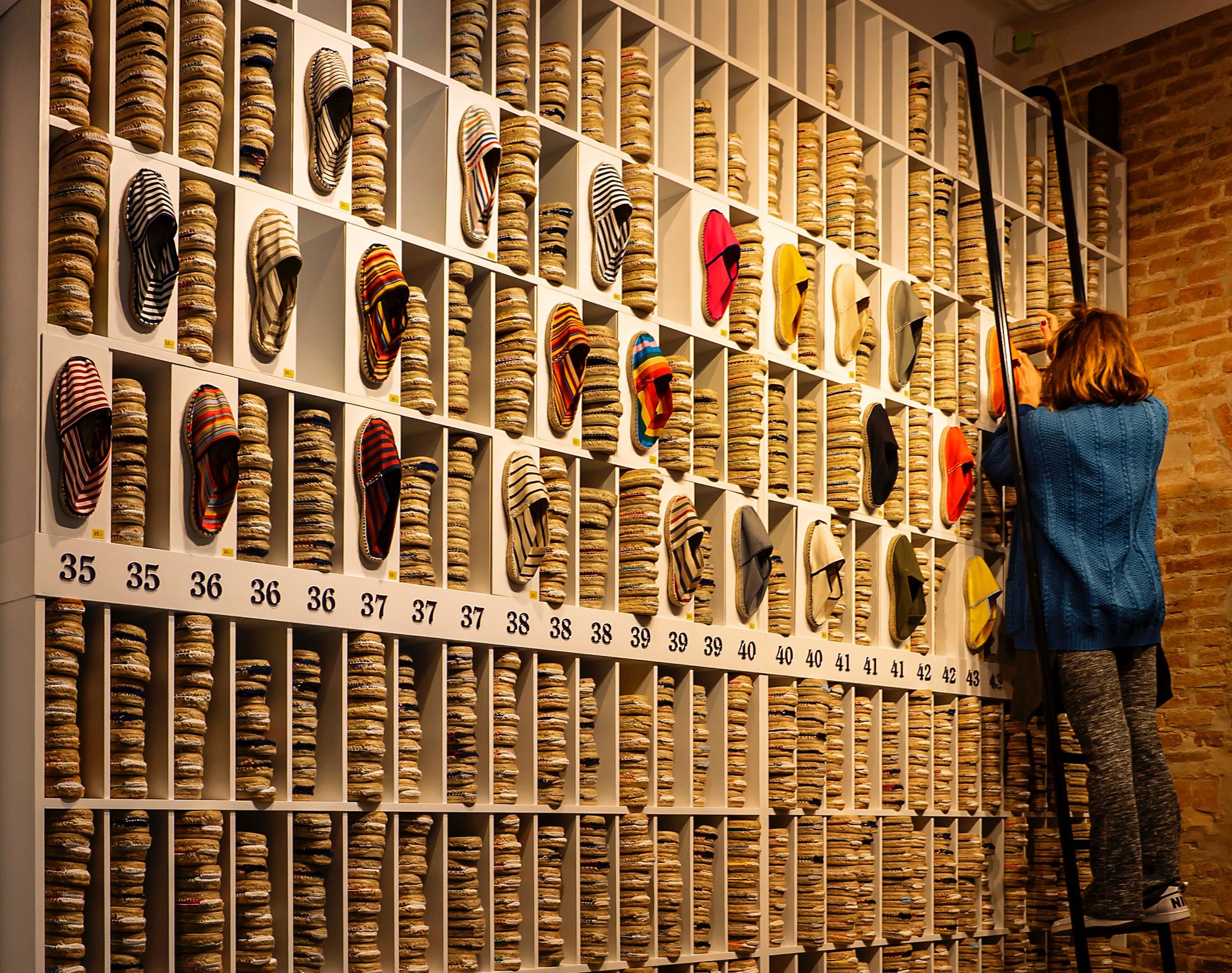 Woman arranging shoes