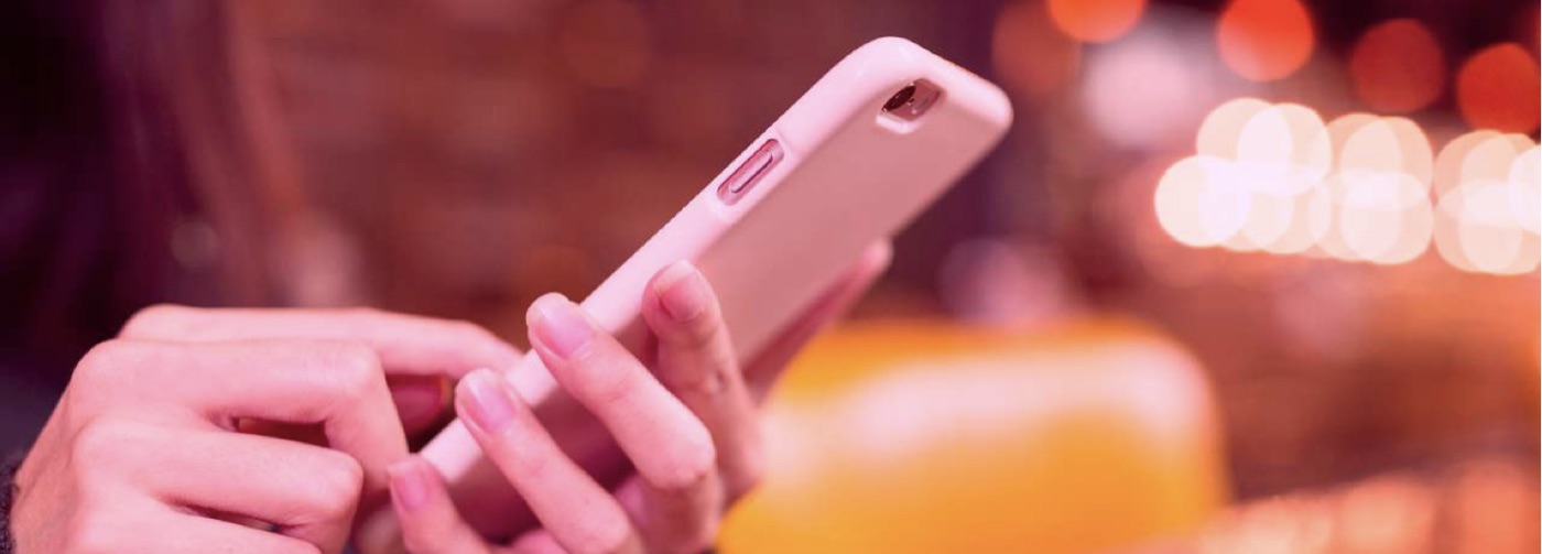 A person typing on a smartphone