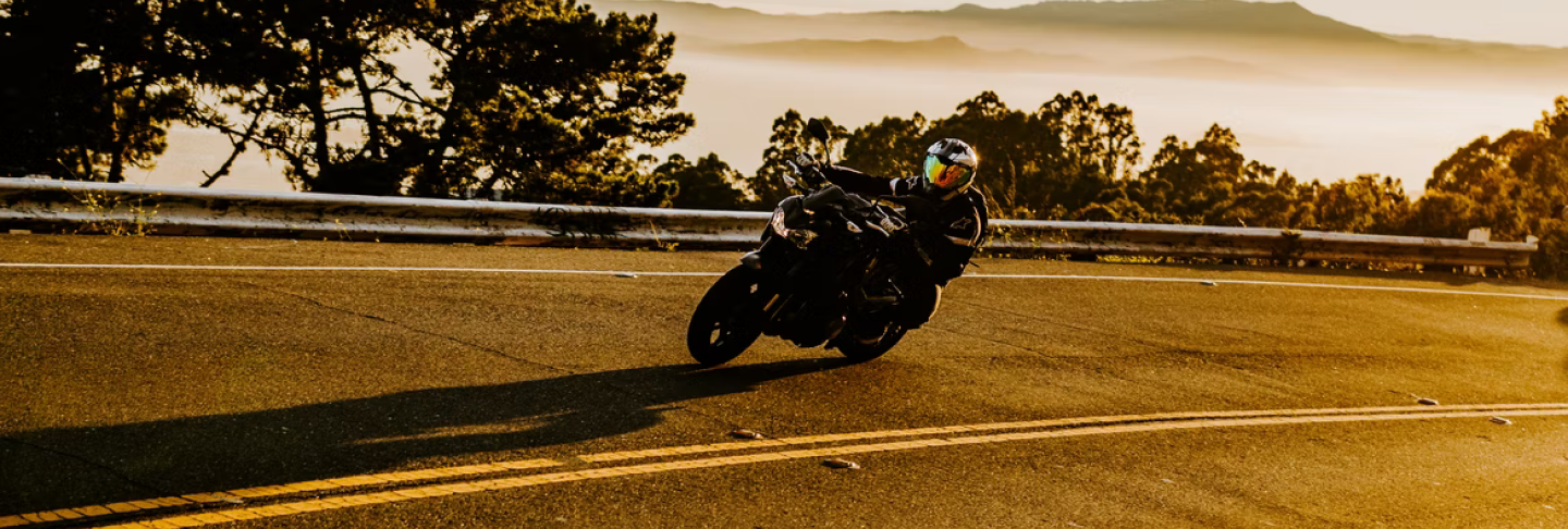 man riding motorcycle on the highway with full gear