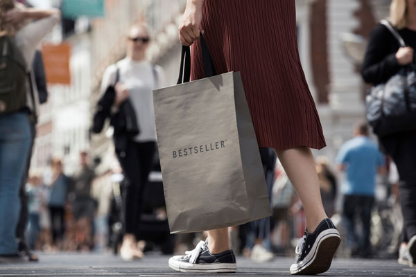 A shopper carrying a Bestseller bag